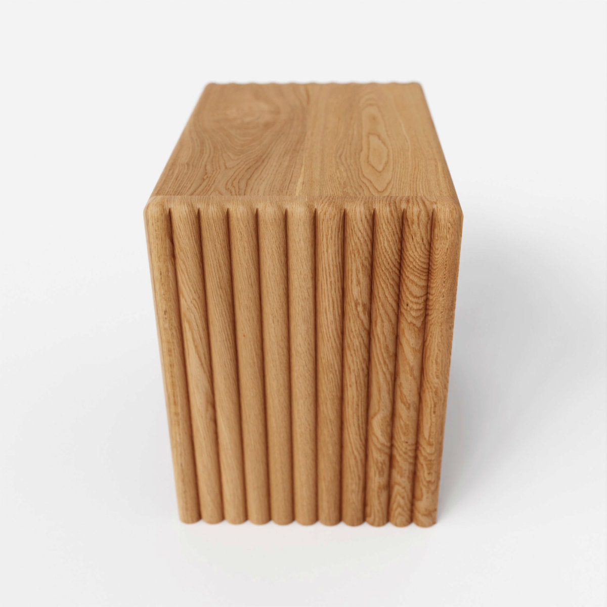 Solid wood nightstand with a ripple detail