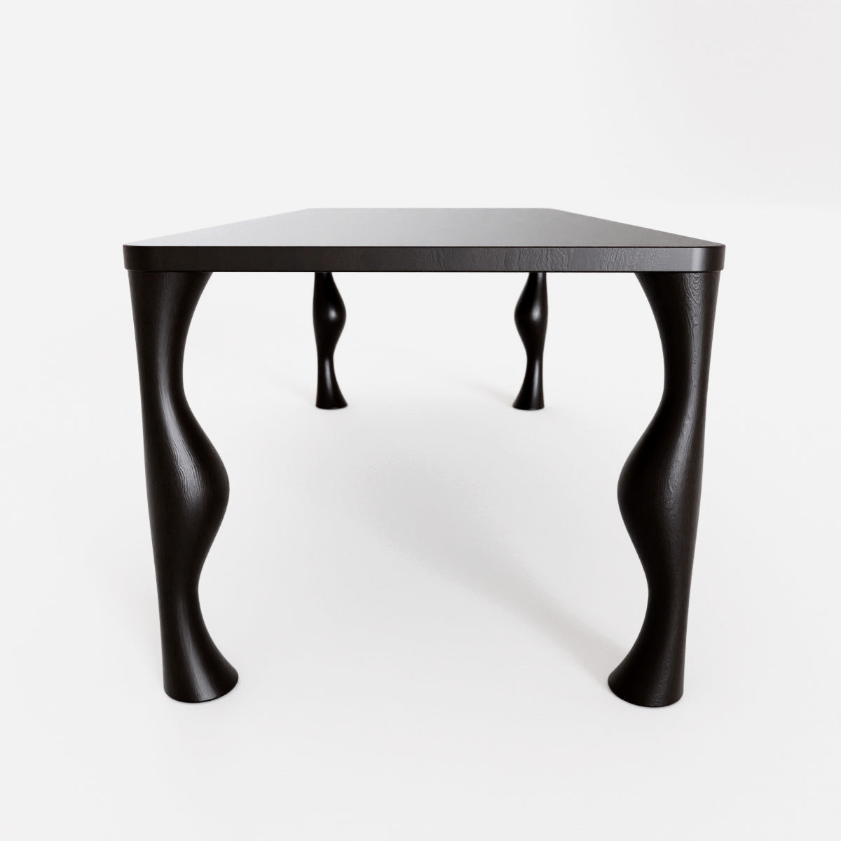 solid oak blackened table with curvy legs