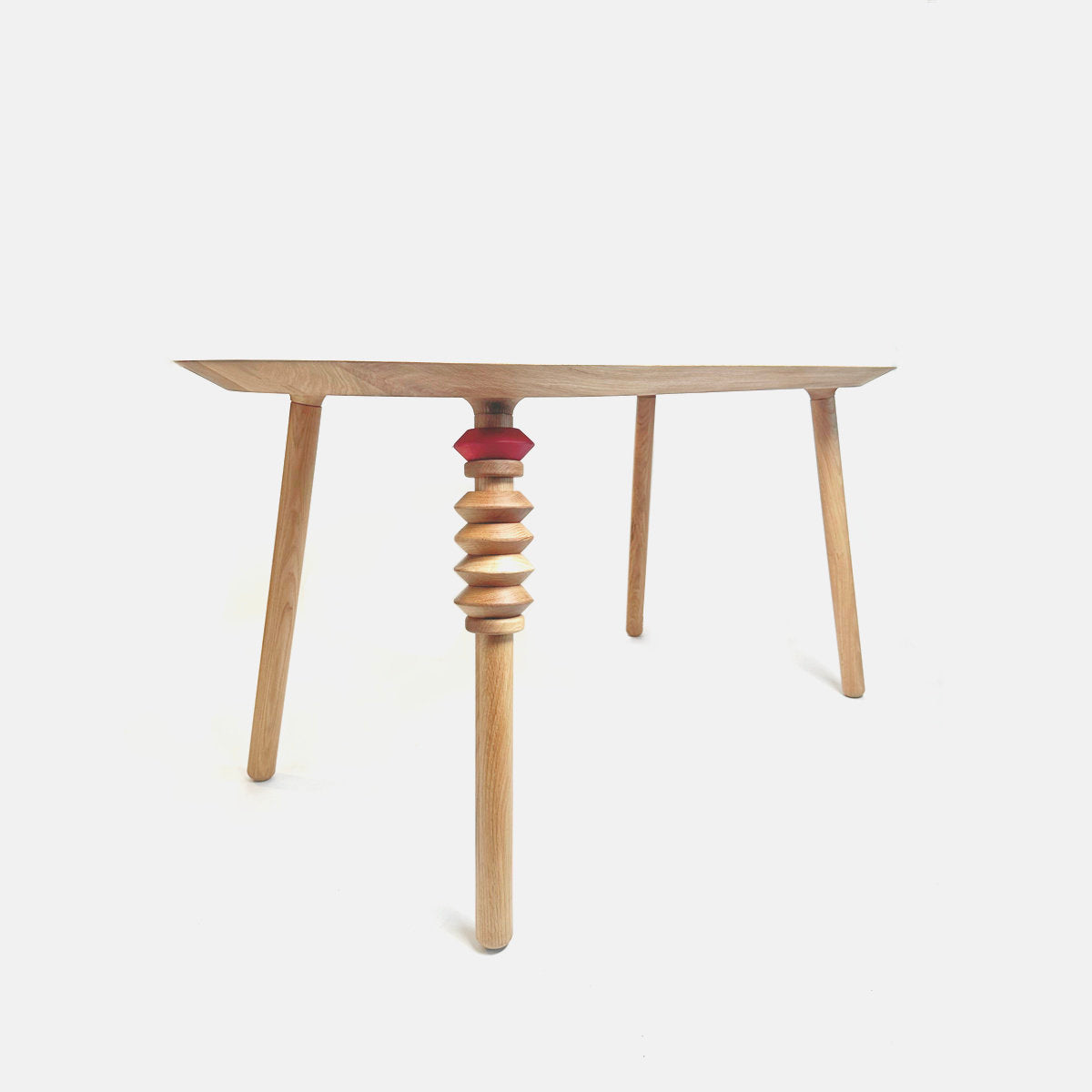 Solid wood dining table with playful beads.