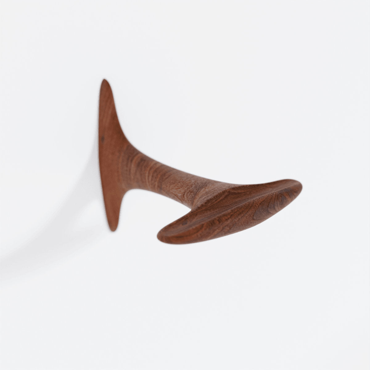 Sculptural bike holder in walnut